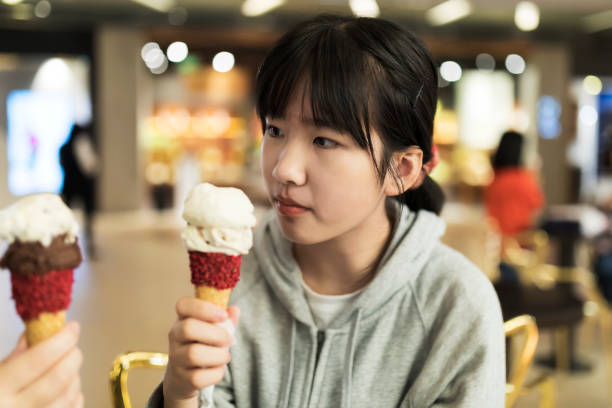istock Young girl with ice cream 1279583823