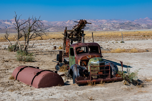 Los Cerillos, New Mexico, United States - September 16, 2023:  Abandoned yard with junk and an old Ford pick-up truck in Cerrillos, New Mexico