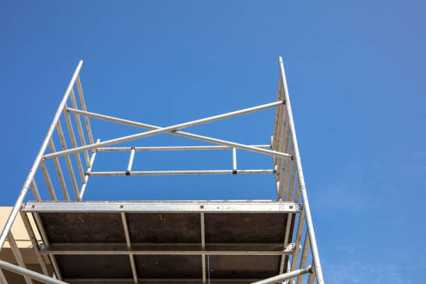 istock Renovation concept, scaffold tower. Below to upper front view, blue sky background. 1279584663