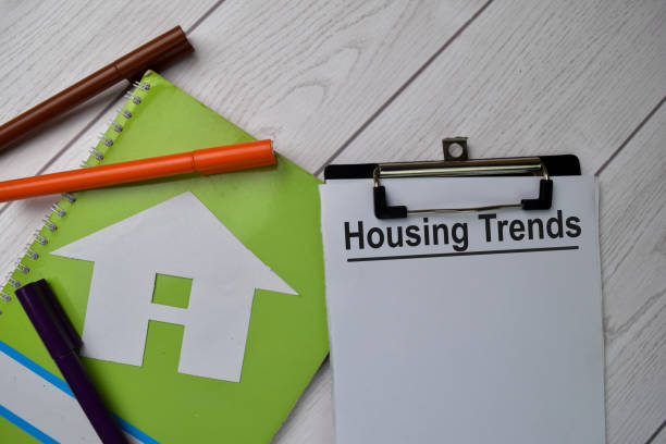 istock Housing Trends text write on paperwork isolated on office desk. 1279585368