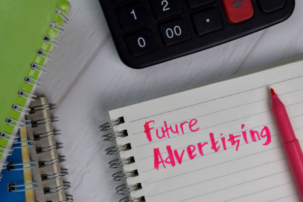 istock Future Advertising write on a book isolated wooden table. 1279586046