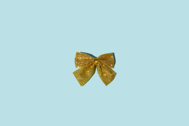 istock christmas ornament golden glitter bow decor blue 1279593234