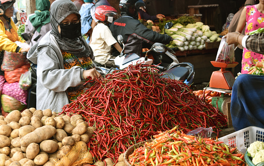Bengkulu, Indonesia - October 11, 2020: Selling red chili and vegetables in traditional markets in the midst of the Corona virus pandemic.