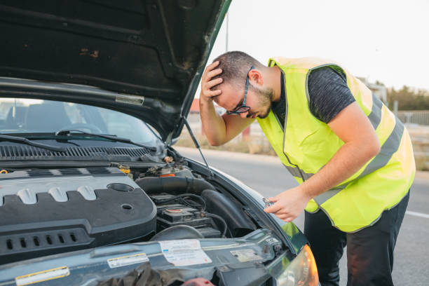 istock Man repairing car on road 1279593430