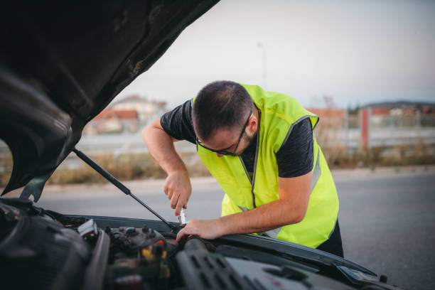 istock Man repairing car on road 1279593433