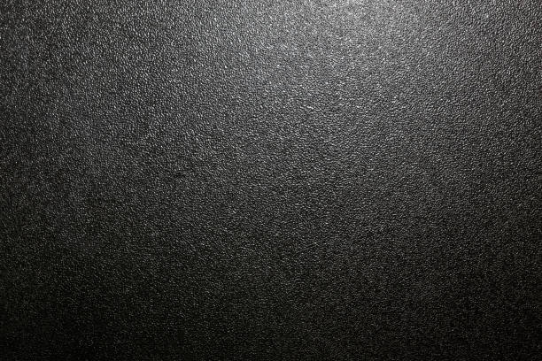 istock dark background of hammered powder paint coating on flat sheet steel surface 1279594590