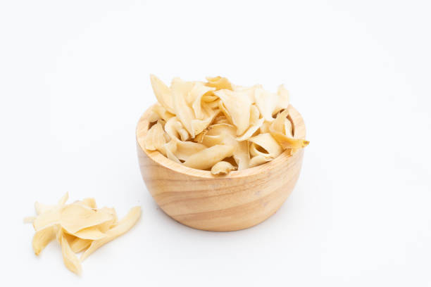 istock gastrodia elata wooden bowl on white 1279597200