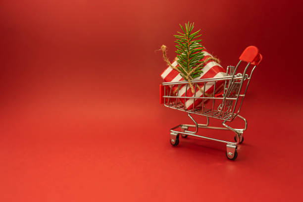 istock A shopping truck with a Christmas present in it 1279599148
