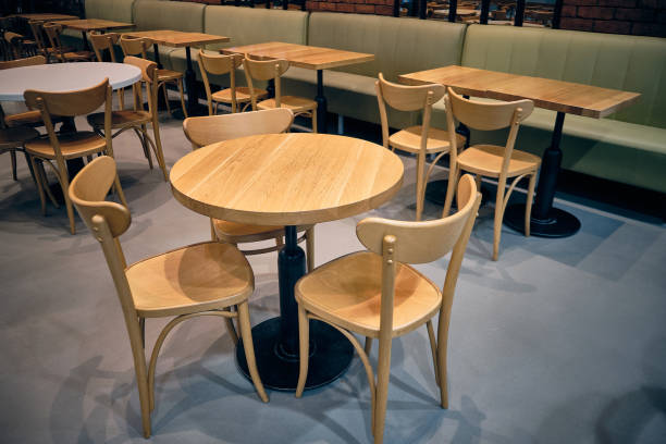 istock Wooden stools and wooden tables at cafe 1279599172