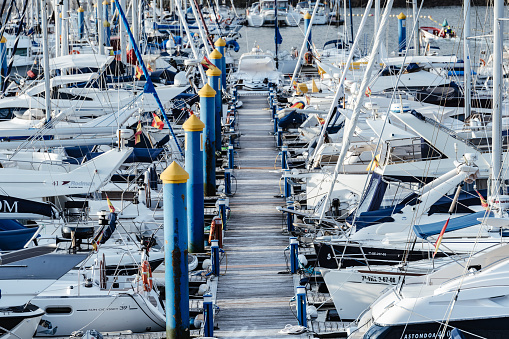 Small sailing boats moored in the yacht club of Sanxenxo on a clear Summer day, Pontevedra, Spain.