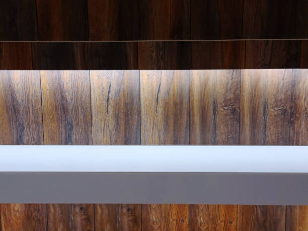 istock Full Frame Background of White Counter Table Against Illuminated Wooden Wall 1279602777