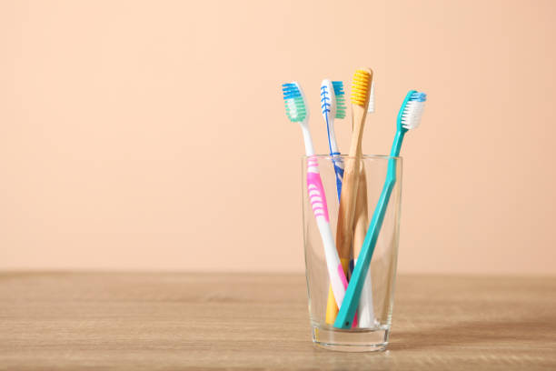 istock natural bamboo toothbrushes on the table. Oral and dental care. 1279605721