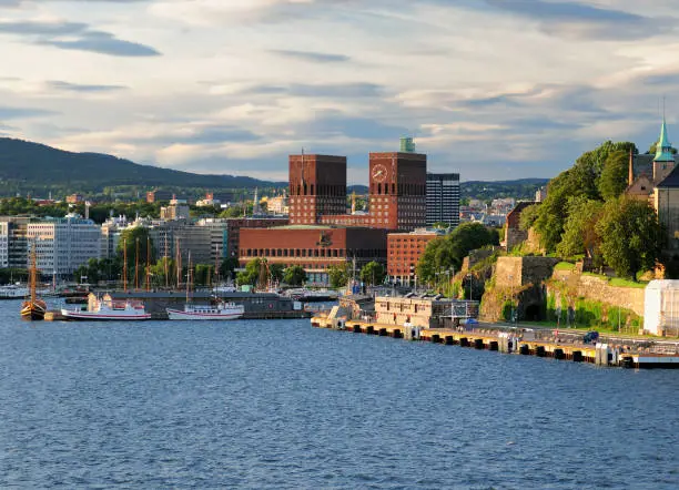 Photo of View From Oslofjord To The Red Brickstone City Hall In The Harbour Of Oslo