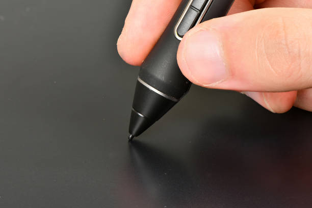istock Hand of the designer with pen 1279607686