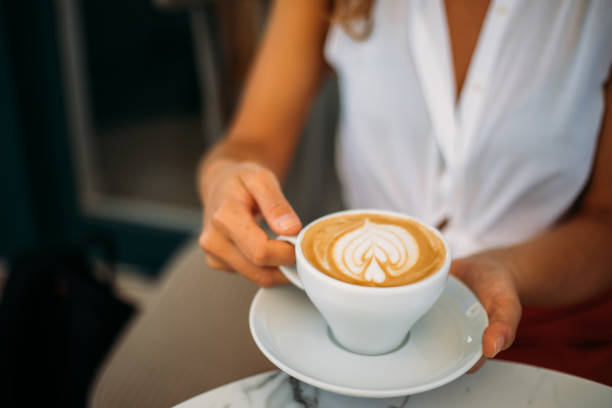 istock Woman holding cup with sth heart-shaped 1279607781