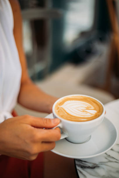 istock Woman holding cup with sth heart-shaped 1279608510