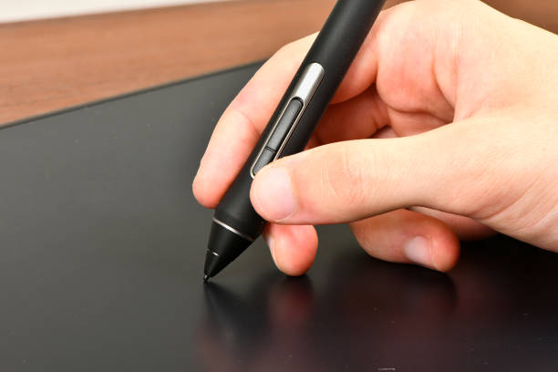 istock Hand of the designer with pen 1279608753
