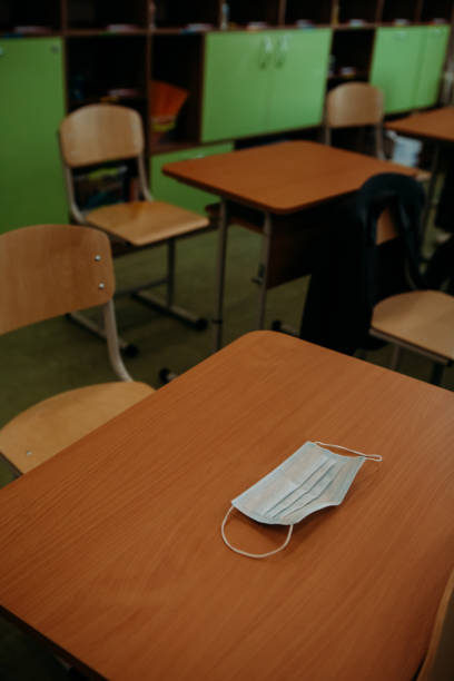 istock simple medical protective mask table school classroom 1279611525