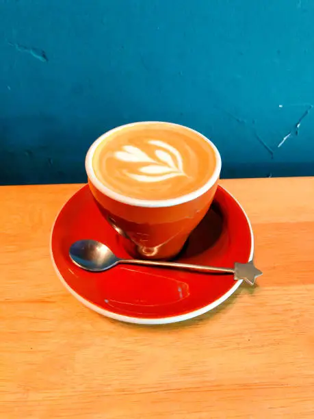 Flatwhite Coffee with a cute Star-shaped teaspoon