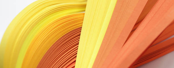 istock Abstract Yellow color wave curl strip paper background. 1279620999