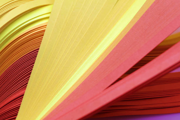 istock Abstract Yellow and Red color wave curl strip paper background. 1279621186