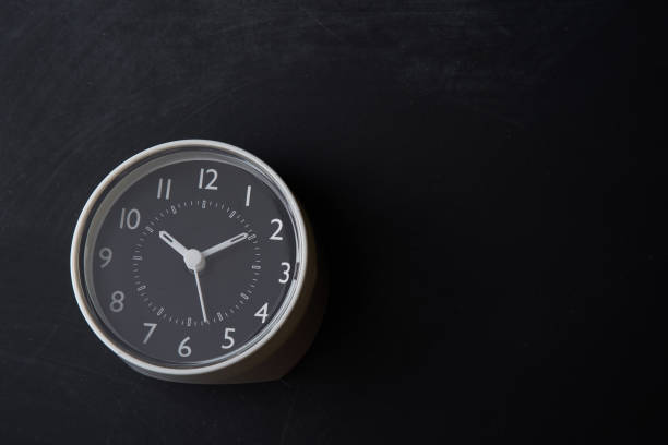 istock alarm clock on the blackboard 1279623947