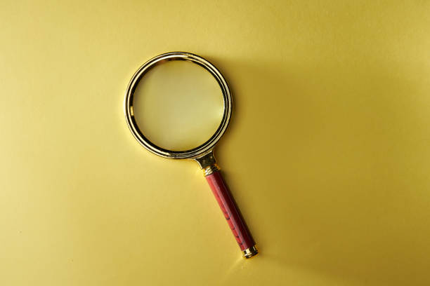 istock magnifying glass on the yellow background 1279624170