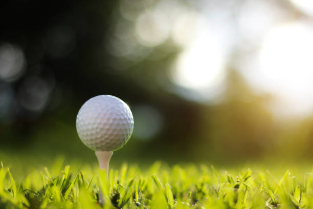 istock golf ball on tee in a beautiful golf course with morning sunshine 1279627536