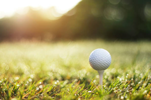 istock golf ball on tee in a beautiful golf course with morning sunshine 1279627537