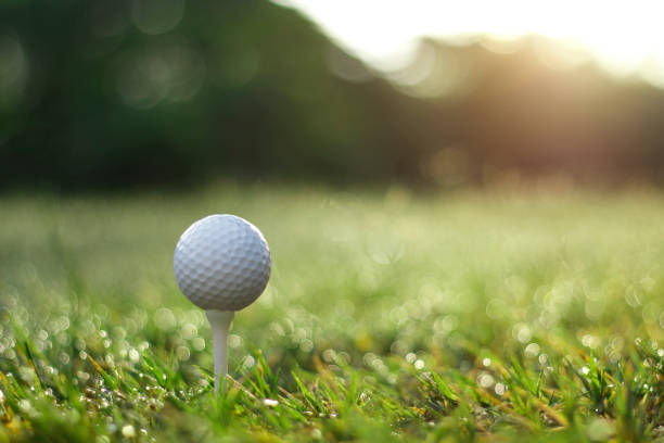 istock golf ball on tee in a beautiful golf course with morning sunshine 1279627538