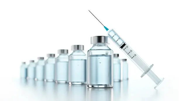 Syringe with Vials of Vaccine isolated on light gray background with copy space