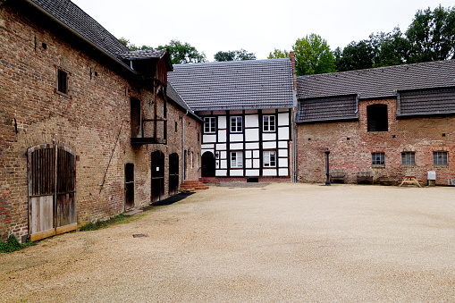 Juechen, Germany, September 27, 2020 - Stable buildings next to the renovated  half-timbered house at Dyck Castle in Jüchen