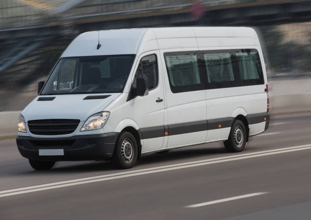 istock Minibus moves on a city street. 1279631695