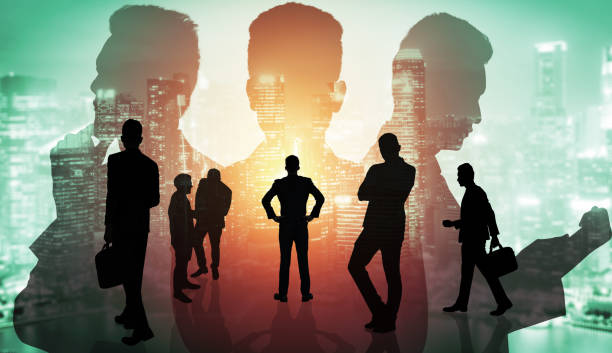 abstract image of many business people together in group on background of city - double exposure imagens e fotografias de stock