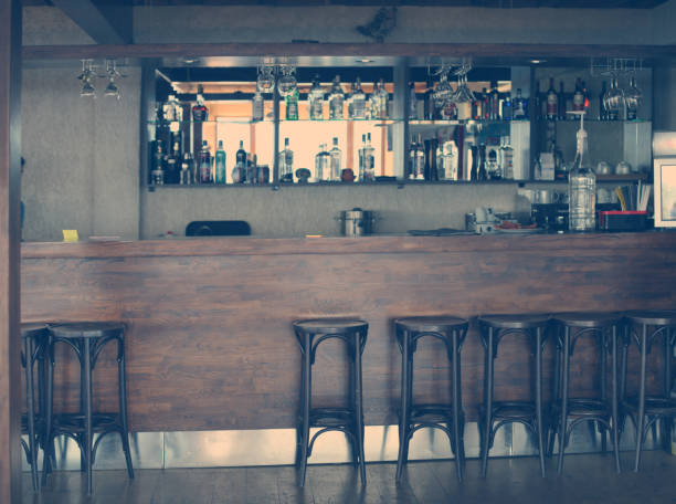 istock Wood alcoholic vintage bar counter interior with chairs. 1279632991