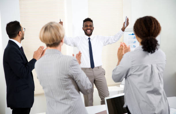 istock Business people clapping hands at business seminar. 1279633355