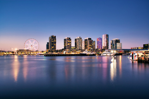 Docklands waterfront with apartments, buildings and Melbourne Star Observation wheel