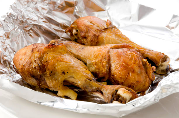 istock Grill Chicken Legs on Aluminum Foil 1279633598