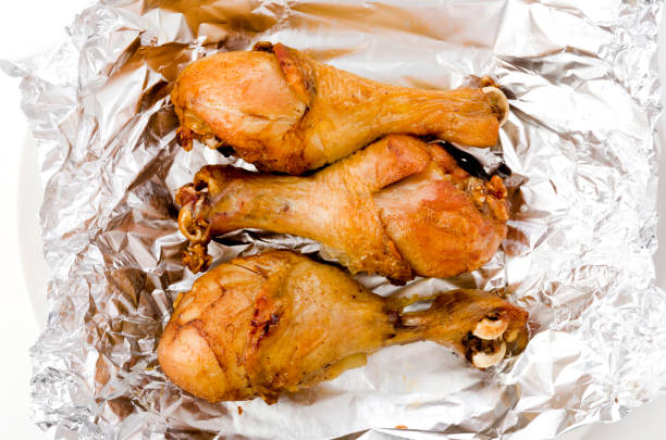 istock Grill Chicken Legs on Aluminum Foil 1279633680