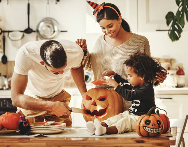 istock Happy multi ethnic family preparing for Halloween celebration 1279634542