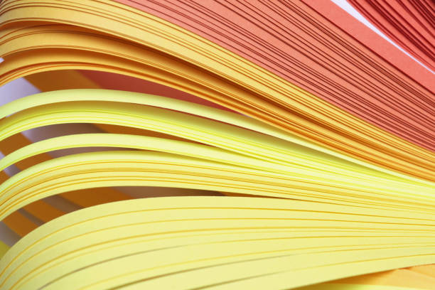 istock Abstract Yellow gradient color wave curl strip paper background. 1279636265