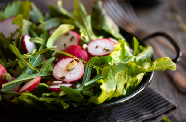 istock Fresh vegetable salad with radish, arugula and lettuce 1279639259