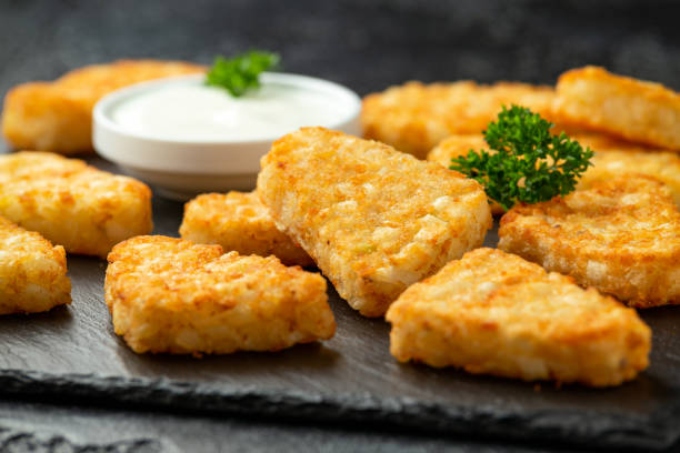 istock Hash brown potato patties on rustic stone board 1279639380