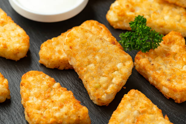 istock Hash brown potato patties on rustic stone board 1279639451