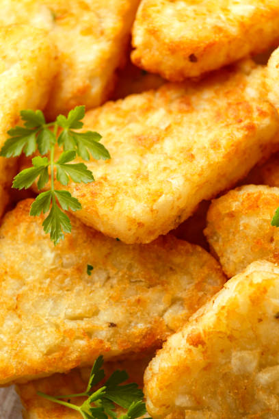 istock Hash brown potato with ketchup on white wooden board 1279639492
