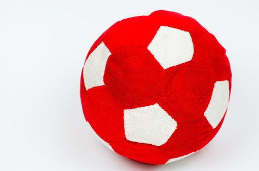 Plush soccer ball red and white. Toy kids ball