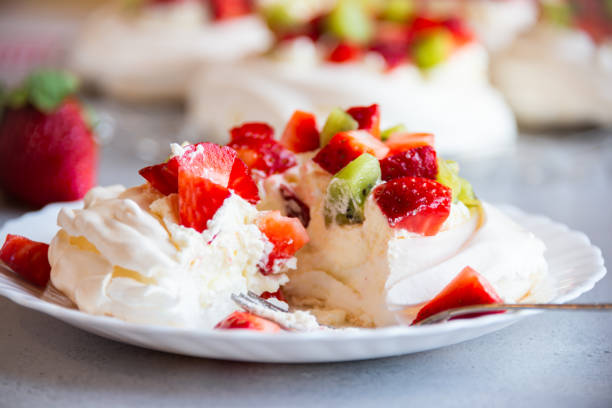 istock Delicious Pavlova cake with meringue and fresh fruit 1279642447