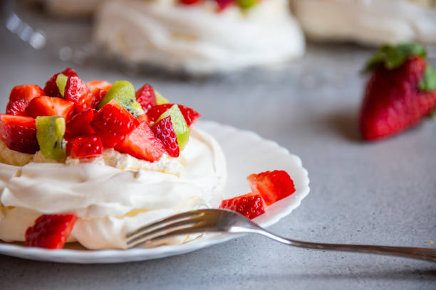 istock Delicious Pavlova cake with meringue and fresh fruit 1279642579
