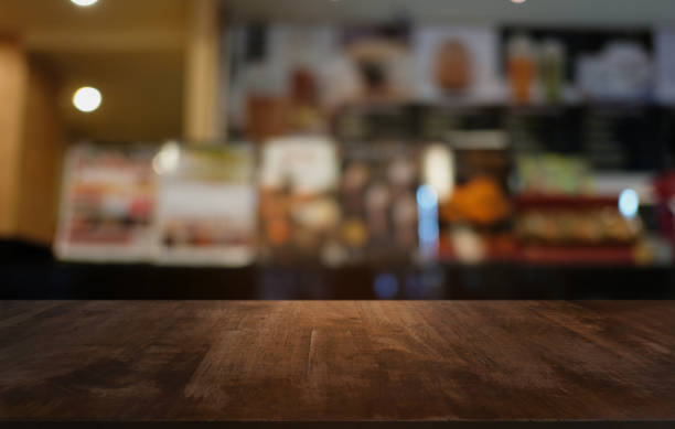 istock Wood Table Top in Blur Background room interior with empty copy space. 1279643439