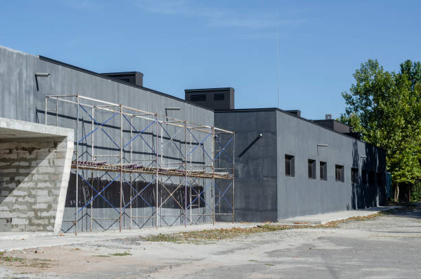 istock Scaffolding near a gray one-story building. 1279644063